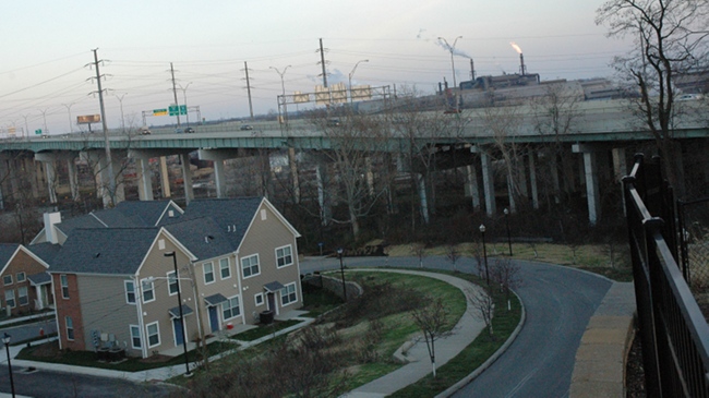 New government-subsidized market-rate Tremont Pointe development located next to Mittal Cleveland Works steel mill and expanding I-490 freeway, in the toxic Cuyahoga River valley