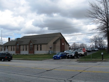 Parishioners leaving a suburban church by car en masse