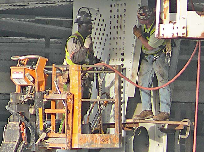 Ironworkers under I 90 inner belt bridge replacing rivets bolts 10.20.09 image jeff buster