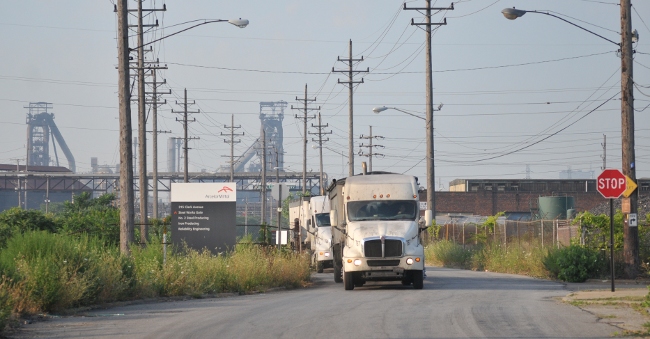 Trucks hauling waste from Mittal Cleveland WOrks steel plant in Cleveland Flats