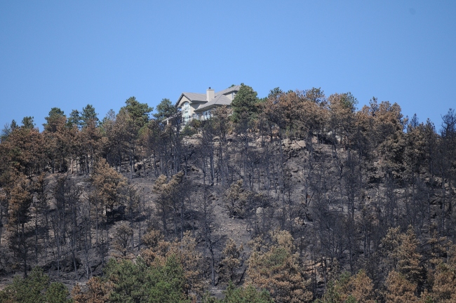  Fourmile Canyon Wildfire, West of Boulder, Colorado, September 2010 - home on hilltop spared from fire