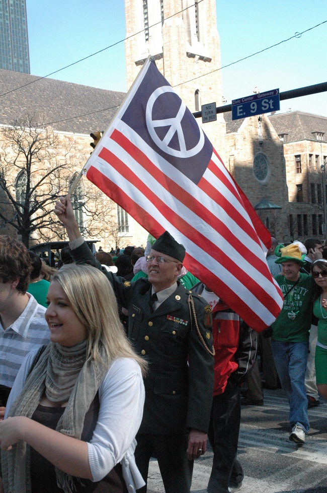 Lou Pumphrey in uniform carrying Flag of Peace in 2009 St. Patrick's Day Parade