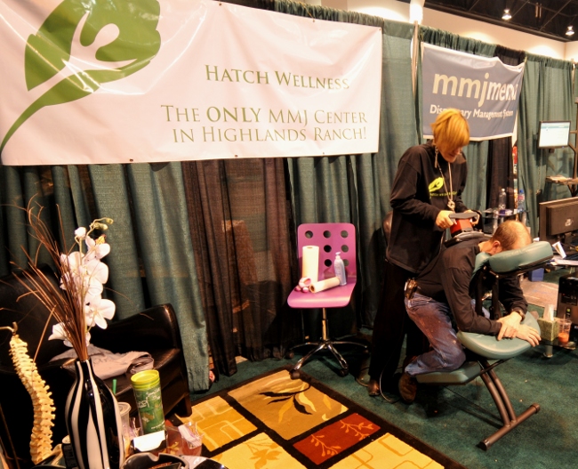 MMJ Provider Hatch Wellness providing back massages at KushCon2, Denver, Colorado