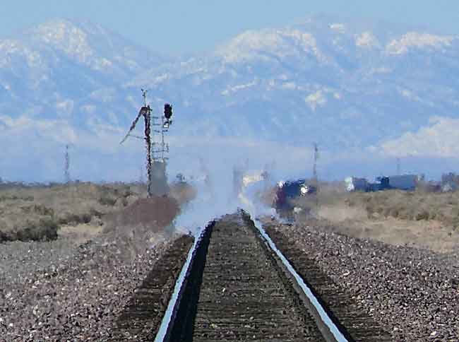mirage on rail road track warp visible light air temperature differential