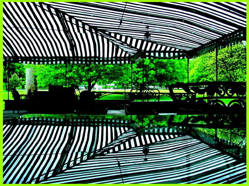 Hunt Club Chagrin patio awning reflected in glass table top image jeff buster