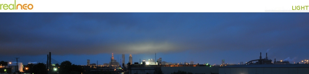 Cleveland skyline in storm with clouds illuminated by Progressive Field