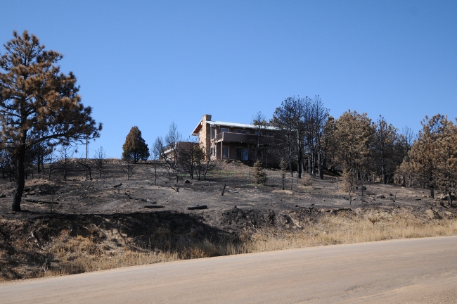  Fourmile Canyon Wildfire, West of Boulder, Colorado, September 2010 - home spared surrounded by ashes