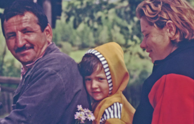 siberian family and child holding flowers on a motor bike kodachrome image jeff buster 2000