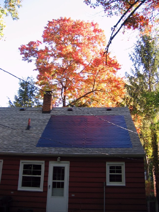 Small house with solar roofing shingles Small house with solar roofing shingles