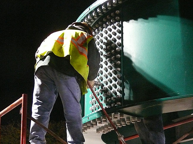 using air impact wrench to pre tighten structural steel bolts followed by torque wrench at 475 foot pounds