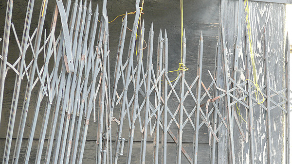 storefront grate held up with yellow string in Cleveland