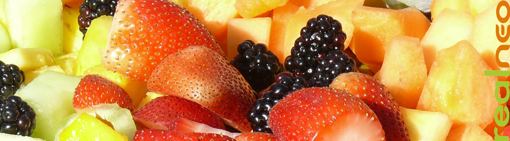 summer berry and melon fruit salad in sunlight 